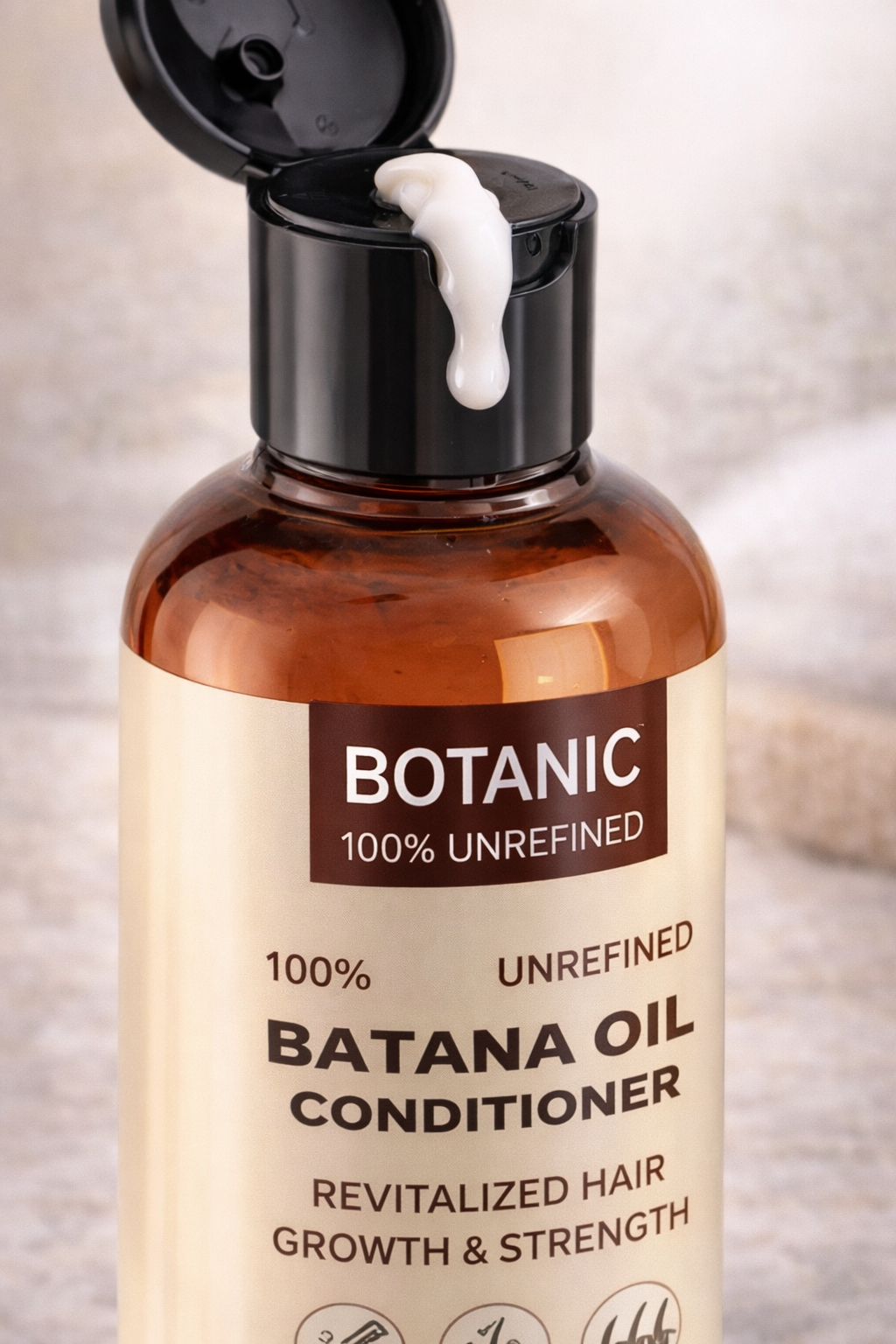 Close up of Batana oil conditioner showing creamy texture and premium packaging